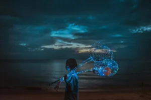 A girl walking sell balloon at the sea