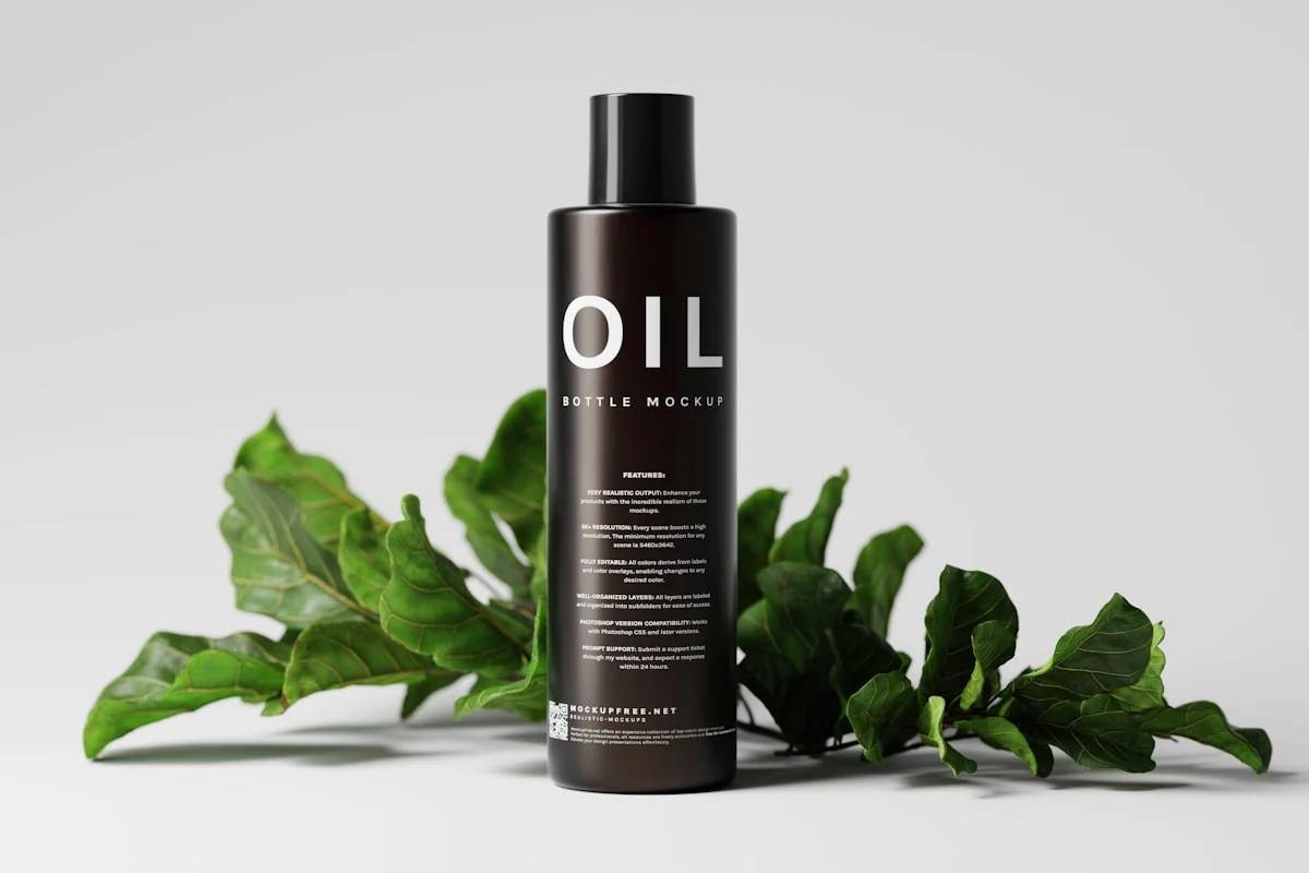 Black Glass Hair Oil Bottle Mockups A set of mockups featuring a black glass bottle for oil and similar liquid product packaging. Download the PSD mockups for free from https://mockupfree.net/