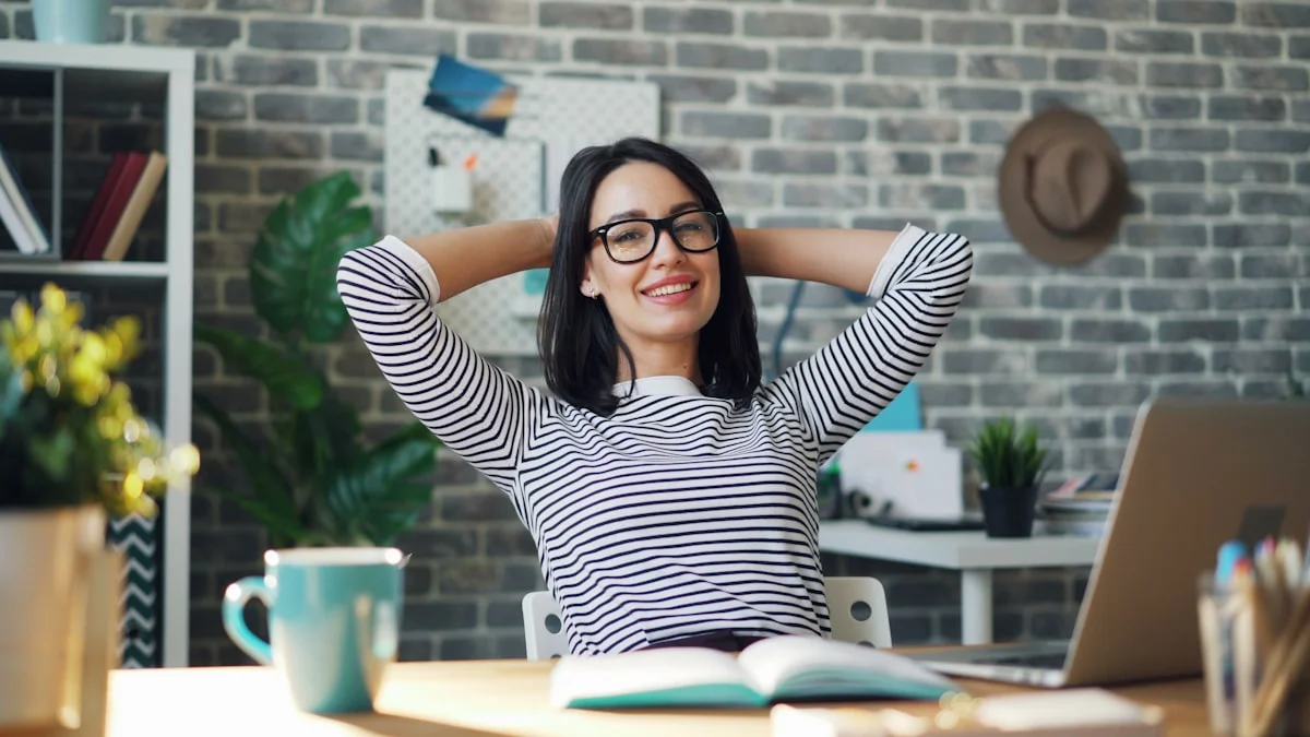 portrait of happy young woman relaxing in offce with cup of coffee