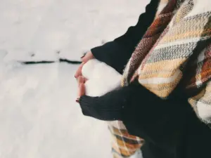 Snow heart in hands